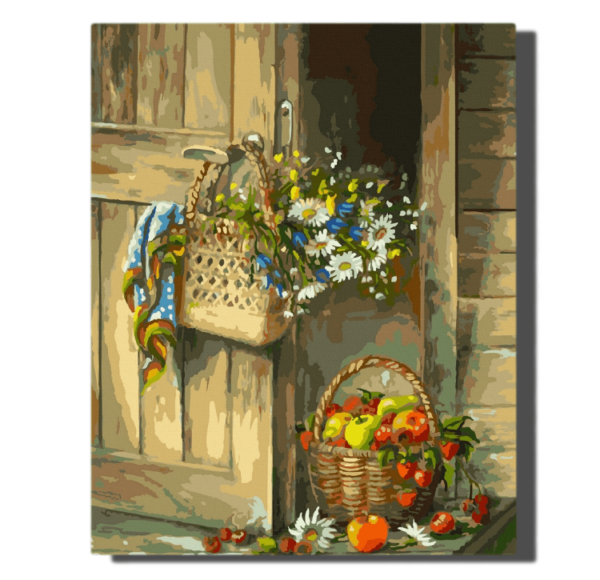 Basket with apples and wild flowers